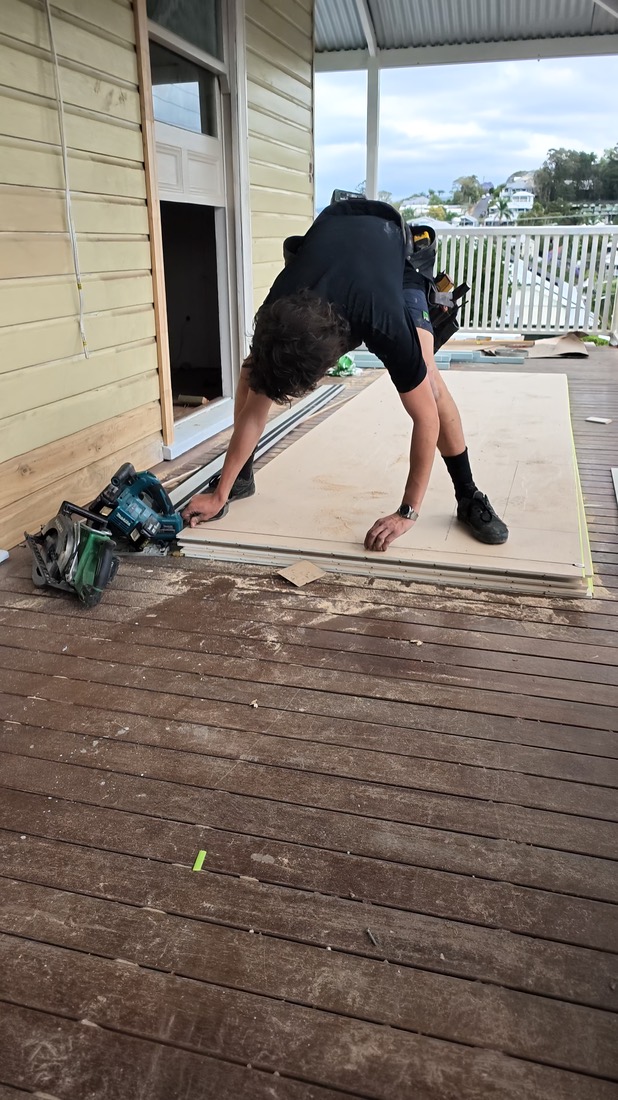 Frame from a clip: cutting sheeting on the deck