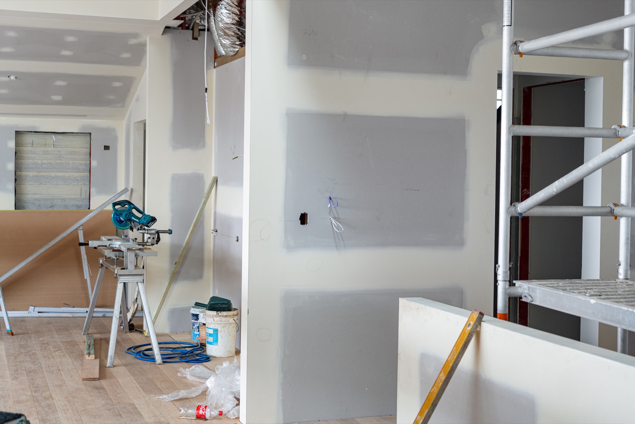 Freshly sheeted white walls in a room ready for paint