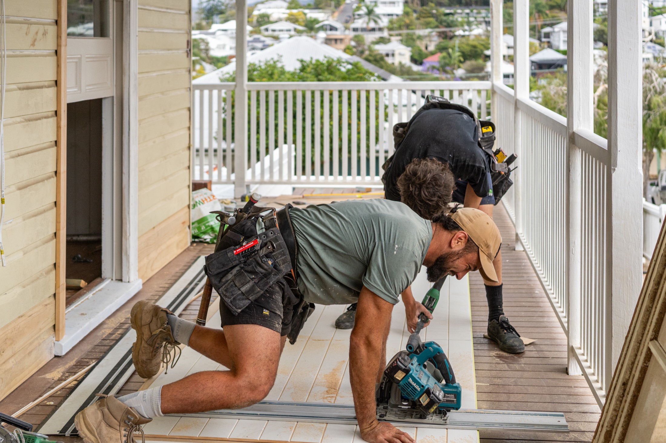 Carpenters at work along the verandah